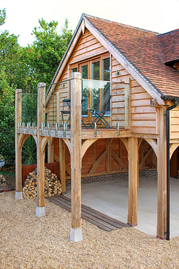 Oak framed barn carport building with glazed balcony