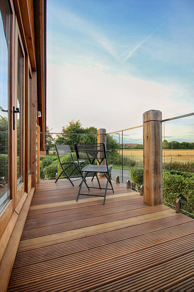 Oak framed garage barn building with room above and glass balcony