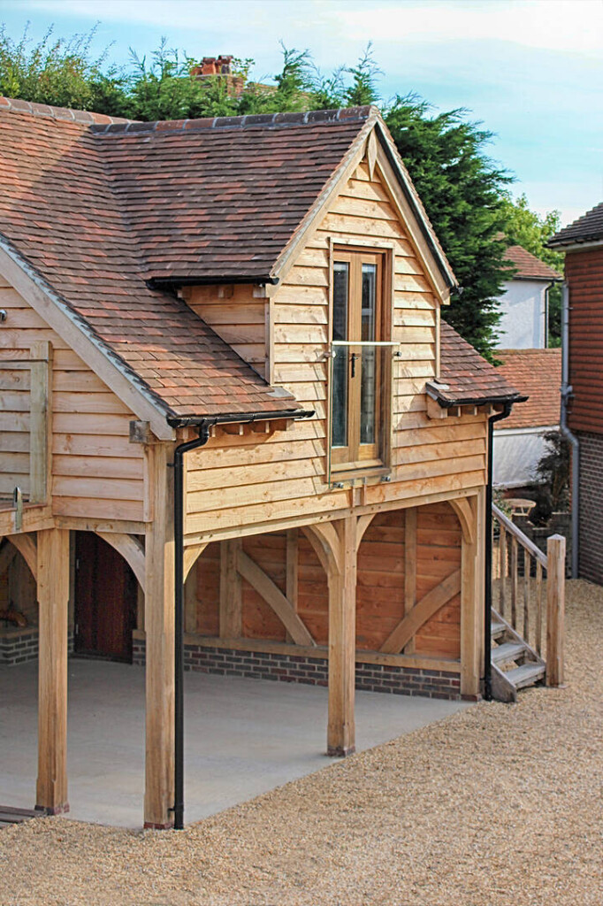 Office room and living space above oak framed carport garage